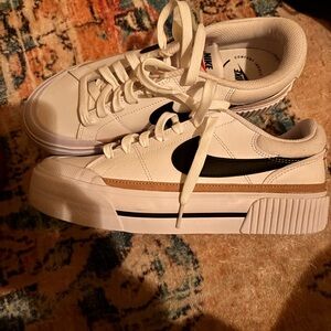 Nike White and Tan Sneakers with Black Swoosh